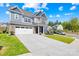 Attractive two-story home with a two-car garage, long driveway, and landscaped front yard at 13547 Roderick Dr, Huntersville, NC 28078