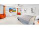 Bright main bedroom featuring neutral tones, ceiling fan, lots of natural light and pops of orange at 13547 Roderick Dr, Huntersville, NC 28078