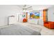 Expansive main bedroom with neutral tones, features a ceiling fan, orange chairs and a large television for comfort at 13547 Roderick Dr, Huntersville, NC 28078