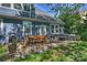 The back patio features a dining table and chairs and outdoor seating with a fire pit at 1405 Ridge Haven Rd, Waxhaw, NC 28173