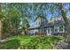 Beautiful backyard featuring a well-maintained lawn, mature trees, and a patio for outdoor entertaining at 1405 Ridge Haven Rd, Waxhaw, NC 28173
