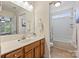 Bathroom featuring a vanity, white countertops, and tub with shower at 1405 Ridge Haven Rd, Waxhaw, NC 28173