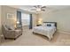 Relaxing bedroom with a ceiling fan, a large window, and neutral décor at 1405 Ridge Haven Rd, Waxhaw, NC 28173