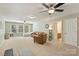 Spacious bonus room with neutral walls and carpet, and multiple ceiling fans at 1405 Ridge Haven Rd, Waxhaw, NC 28173