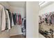 Spacious walk-in closet with built-in shelving and ample storage for clothing and shoes at 1405 Ridge Haven Rd, Waxhaw, NC 28173