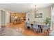 Open-concept kitchen and dining area with modern lighting and hardwood floors at 1405 Ridge Haven Rd, Waxhaw, NC 28173