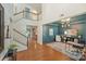 Elegant foyer with hardwood floors, an open staircase, and views into the living spaces at 1405 Ridge Haven Rd, Waxhaw, NC 28173