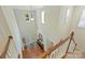 Two-story foyer with wood floors, a chandelier, transom windows, and stairs at 1405 Ridge Haven Rd, Waxhaw, NC 28173