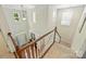 Two-story foyer with wood floors, a chandelier, transom windows, and stairs at 1405 Ridge Haven Rd, Waxhaw, NC 28173