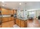 Spacious eat-in kitchen with wooden cabinets, granite countertops, and stainless steel appliances at 1405 Ridge Haven Rd, Waxhaw, NC 28173