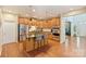 Spacious kitchen featuring stainless steel appliances, a center island, and wood cabinetry at 1405 Ridge Haven Rd, Waxhaw, NC 28173