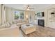 Bright living room featuring fireplace, lots of natural light, and neutral decor at 1405 Ridge Haven Rd, Waxhaw, NC 28173