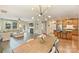 Open concept featuring living room, dining area, and kitchen, ideal for gatherings at 1405 Ridge Haven Rd, Waxhaw, NC 28173