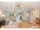 Living room featuring fireplace, lots of natural light, and access to the outdoors at 1405 Ridge Haven Rd, Waxhaw, NC 28173