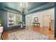 Bright home office featuring tray ceilings, hardwood floors, and plenty of natural light at 1405 Ridge Haven Rd, Waxhaw, NC 28173