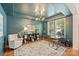 Stylish home office with hardwood floors, statement lighting, and large windows at 1405 Ridge Haven Rd, Waxhaw, NC 28173
