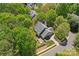 Aerial view of a house with mature trees and a landscaped yard on a sunny day at 15744 Berryfield St, Huntersville, NC 28078