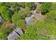 Aerial view of the property showcasing the home's position on a tree-lined street at 15744 Berryfield St, Huntersville, NC 28078