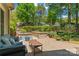 Cozy backyard patio area with comfortable seating and beautiful landscaping at 15744 Berryfield St, Huntersville, NC 28078