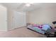 This carpeted bedroom with a ceiling fan and large closet provides comfortable space for rest and relaxation at 15744 Berryfield St, Huntersville, NC 28078