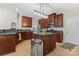 Spacious kitchen with granite countertops, stainless steel appliances, and central island, perfect for cooking at 15744 Berryfield St, Huntersville, NC 28078