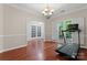Spacious living room with hardwood floors, large windows, and elegant lighting, providing a comfortable and inviting space at 15744 Berryfield St, Huntersville, NC 28078