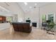 Bright living room featuring a fireplace, large windows, and tile floors perfect for entertaining and relaxing at 15744 Berryfield St, Huntersville, NC 28078