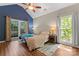 Bright and spacious main bedroom featuring high ceilings, natural light, and hardwood floors, for peaceful relaxation at 15744 Berryfield St, Huntersville, NC 28078