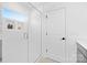 Bathroom walk-in shower with glass door and built-in shelving, alongside a doorway at 2129 Tom Sadler Rd # 7160, Charlotte, NC 28214