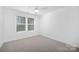 Cozy bedroom with neutral decor, a window, and comfortable carpet at 2129 Tom Sadler Rd # 7160, Charlotte, NC 28214