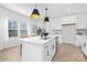 Spacious kitchen with a large island, stainless steel appliances, quartz countertops, and pendant lights at 2129 Tom Sadler Rd # 7160, Charlotte, NC 28214
