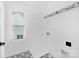 Bright laundry room with patterned tile floor, utility sink hookups, and window at 2129 Tom Sadler Rd # 7160, Charlotte, NC 28214