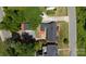 Overhead view of a charming home with a well-maintained yard and detached garage at 2138 Revolution Park Dr, Charlotte, NC 28208
