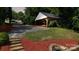 Spacious backyard showing a shed and stone fire pit surrounded by lush greenery at 2138 Revolution Park Dr, Charlotte, NC 28208