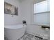 Inviting bathroom showcases a modern soaking tub, stylish tile flooring, and serene natural light at 2138 Revolution Park Dr, Charlotte, NC 28208