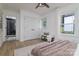Bedroom with a view to a black shower with a glass door, a ceiling fan, and a cushioned seat at 2138 Revolution Park Dr, Charlotte, NC 28208