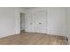 A spacious bedroom with hardwood floors and a closet, ready for comfort and personalization at 2138 Revolution Park Dr, Charlotte, NC 28208