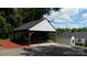 Spacious carport with stylish support beams, offering ample parking space at 2138 Revolution Park Dr, Charlotte, NC 28208