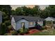 This charming home features a cozy front porch and tidy landscaping at 2138 Revolution Park Dr, Charlotte, NC 28208