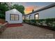 Charming home boasts a paved driveway, manicured bushes, and an inviting exterior at 2138 Revolution Park Dr, Charlotte, NC 28208