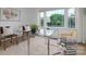 Bright office space featuring a glass desk, stylish decor, and large windows with a scenic view at 2138 Revolution Park Dr, Charlotte, NC 28208