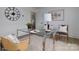Modern office with a glass desk, neutral rug, and bright natural light at 2138 Revolution Park Dr, Charlotte, NC 28208
