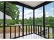 Screened-in patio offering an outdoor living space with views of the yard and surrounding greenery at 2138 Revolution Park Dr, Charlotte, NC 28208