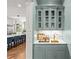 Stylish bar area featuring custom cabinetry, marble countertop, and designer fixtures, perfect for entertaining guests at 2200 Hastings Dr, Charlotte, NC 28207