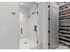 Walk-in shower featuring marble tile and gold fixtures at 2200 Hastings Dr, Charlotte, NC 28207