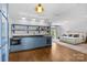 Open-concept bedroom with a convenient kitchenette and a cozy atmosphere, ideal for comfortable living at 2200 Hastings Dr, Charlotte, NC 28207