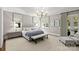 Spacious bedroom with a chandelier, carpet, natural light, and a sitting area at 2200 Hastings Dr, Charlotte, NC 28207