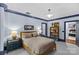 Neutral bedroom with blue trim and two closets near the bed at 2200 Hastings Dr, Charlotte, NC 28207