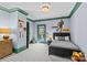 Basketball themed bedroom with gray and green trim, single bed, and wood dresser at 2200 Hastings Dr, Charlotte, NC 28207