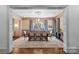 Elegant dining room featuring a large table with seating for eight and sophisticated wallpaper at 2200 Hastings Dr, Charlotte, NC 28207